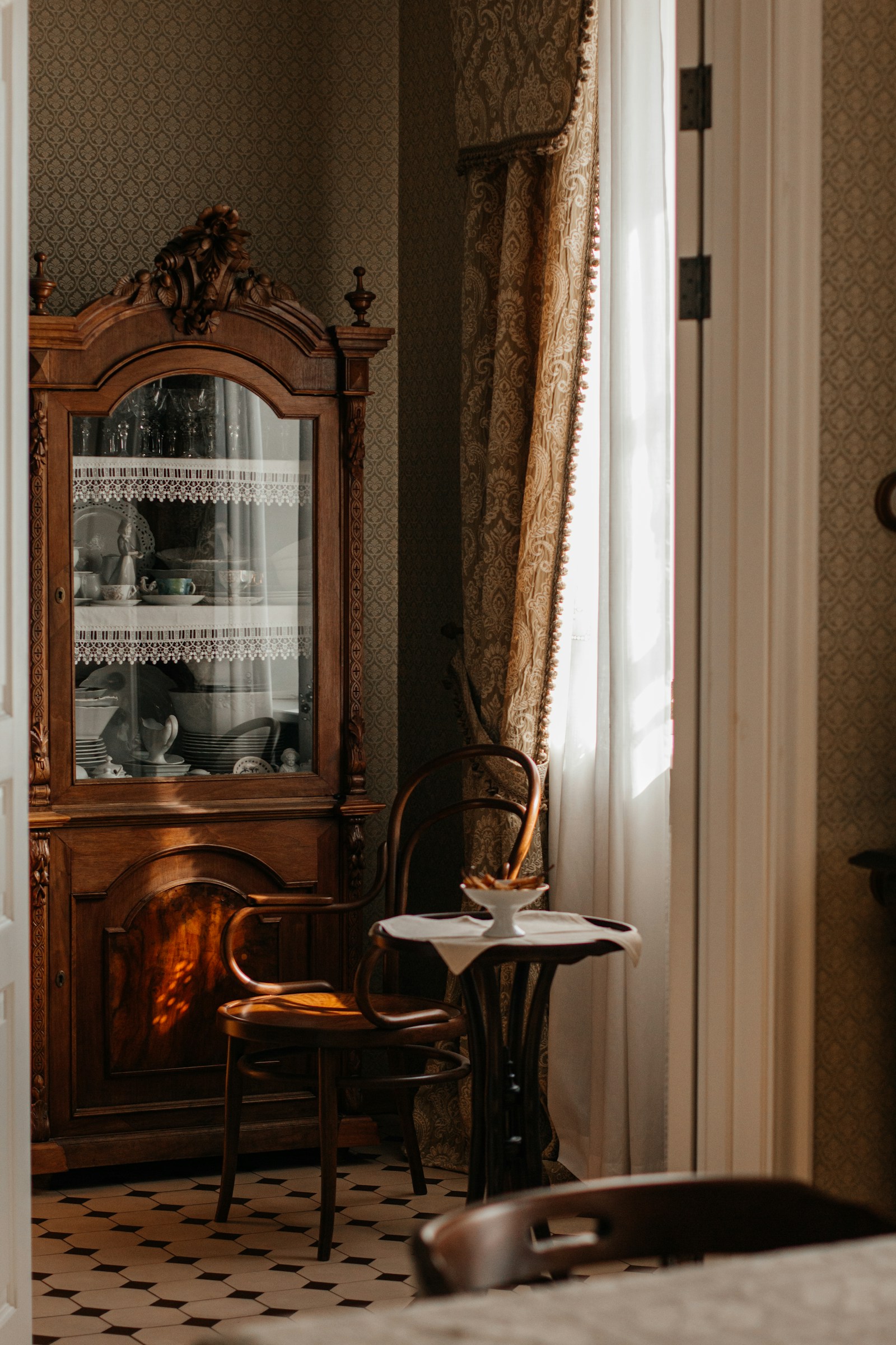 Antique style Victorian hutch with ornate period cabinetry and rich patina finish