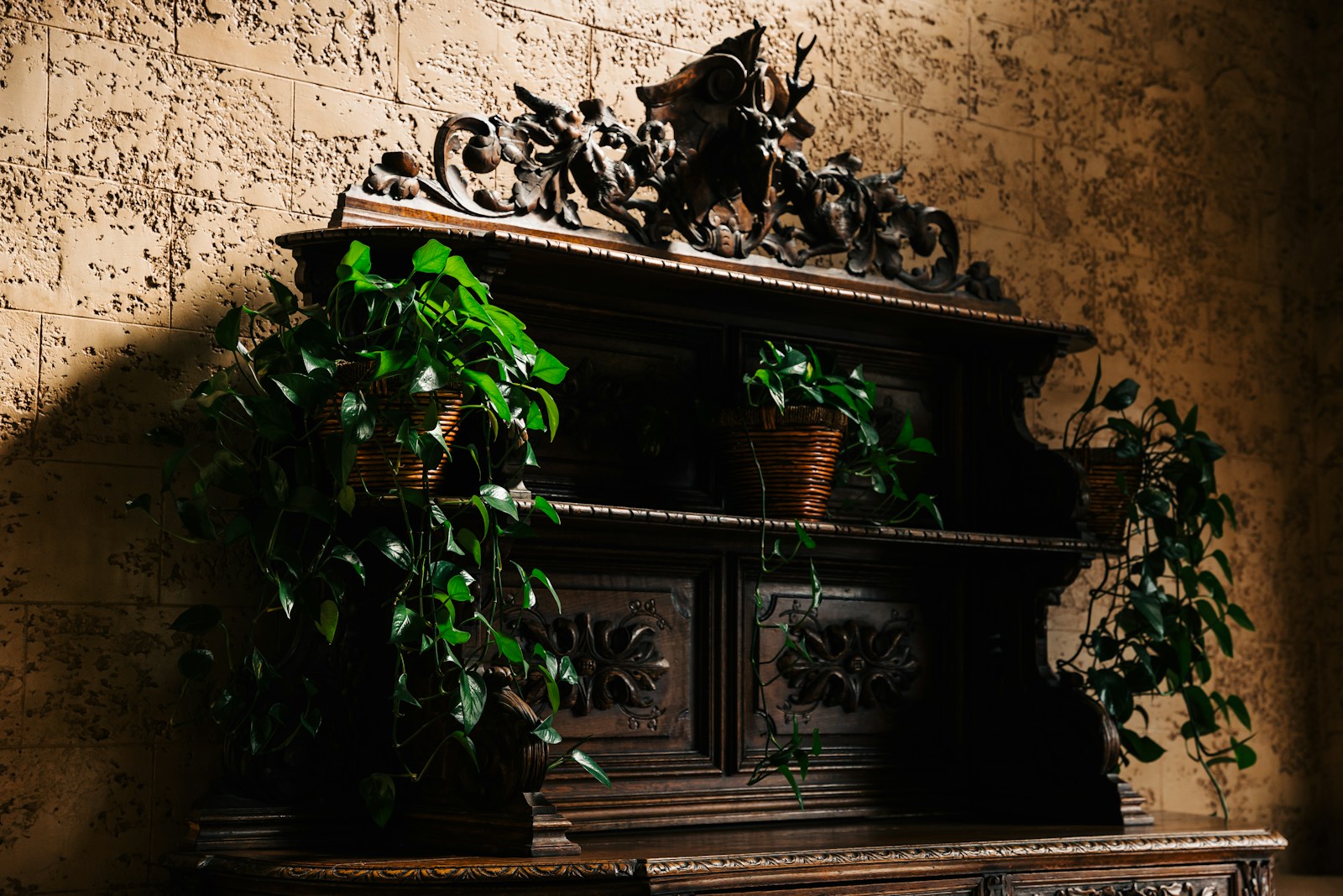 Gilded baroque wood furniture with ornate carved panel details and luxurious finish