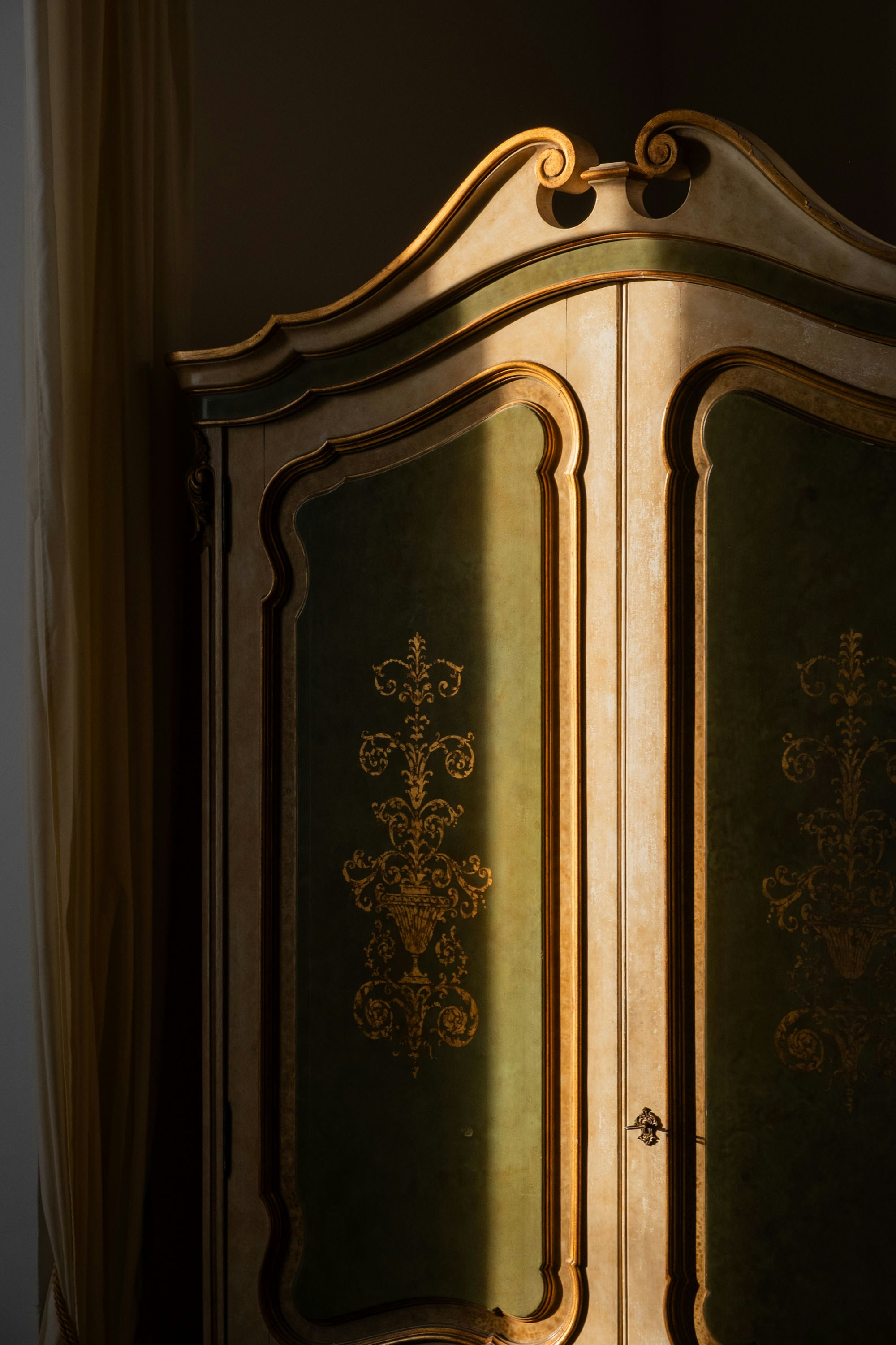 Baroque painted armoire cabinet green panels gilded gold scrollwork ornate motifs