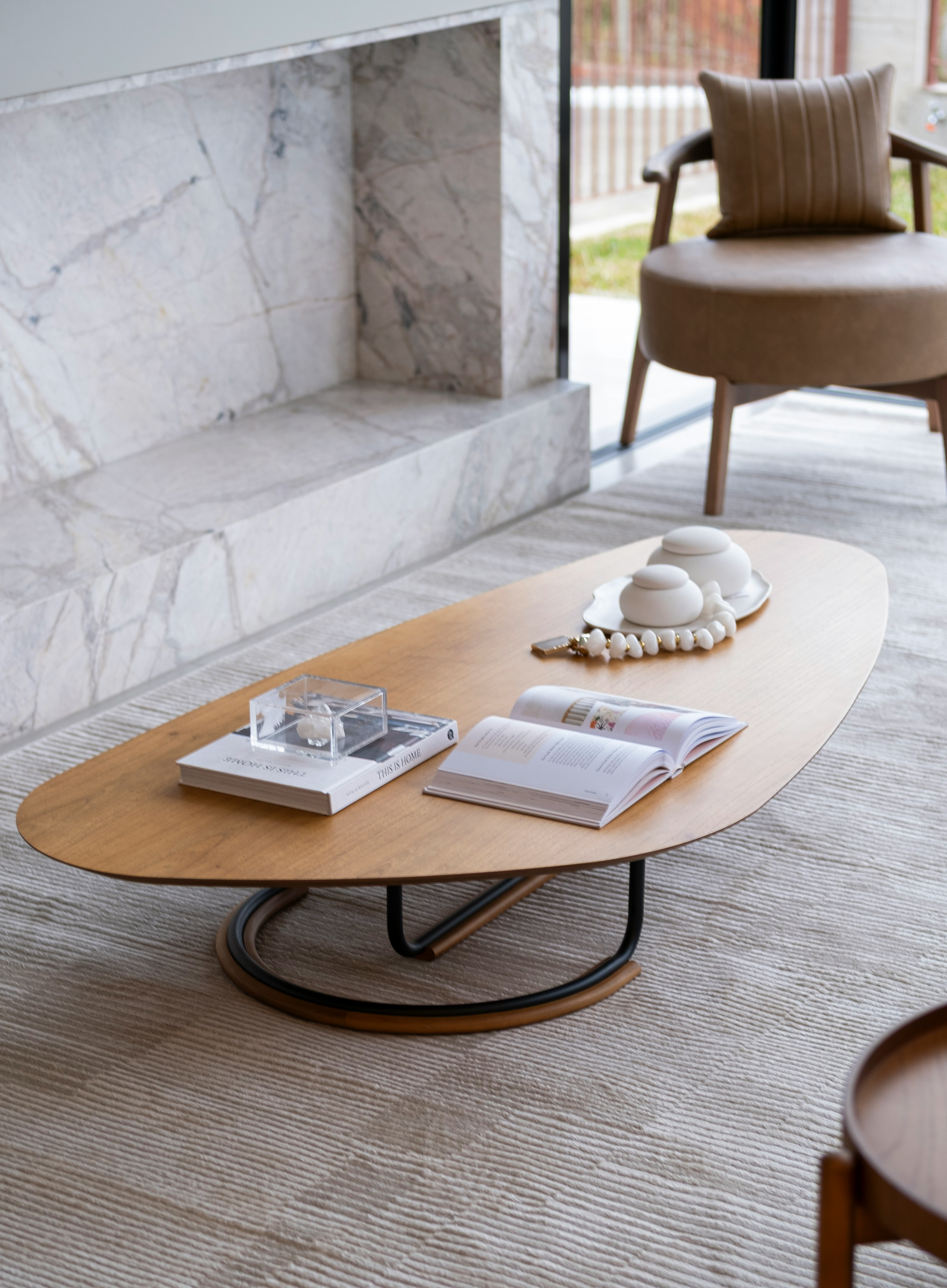 Custom oval wood coffee table luxury living room marble stone fireplace warm interior