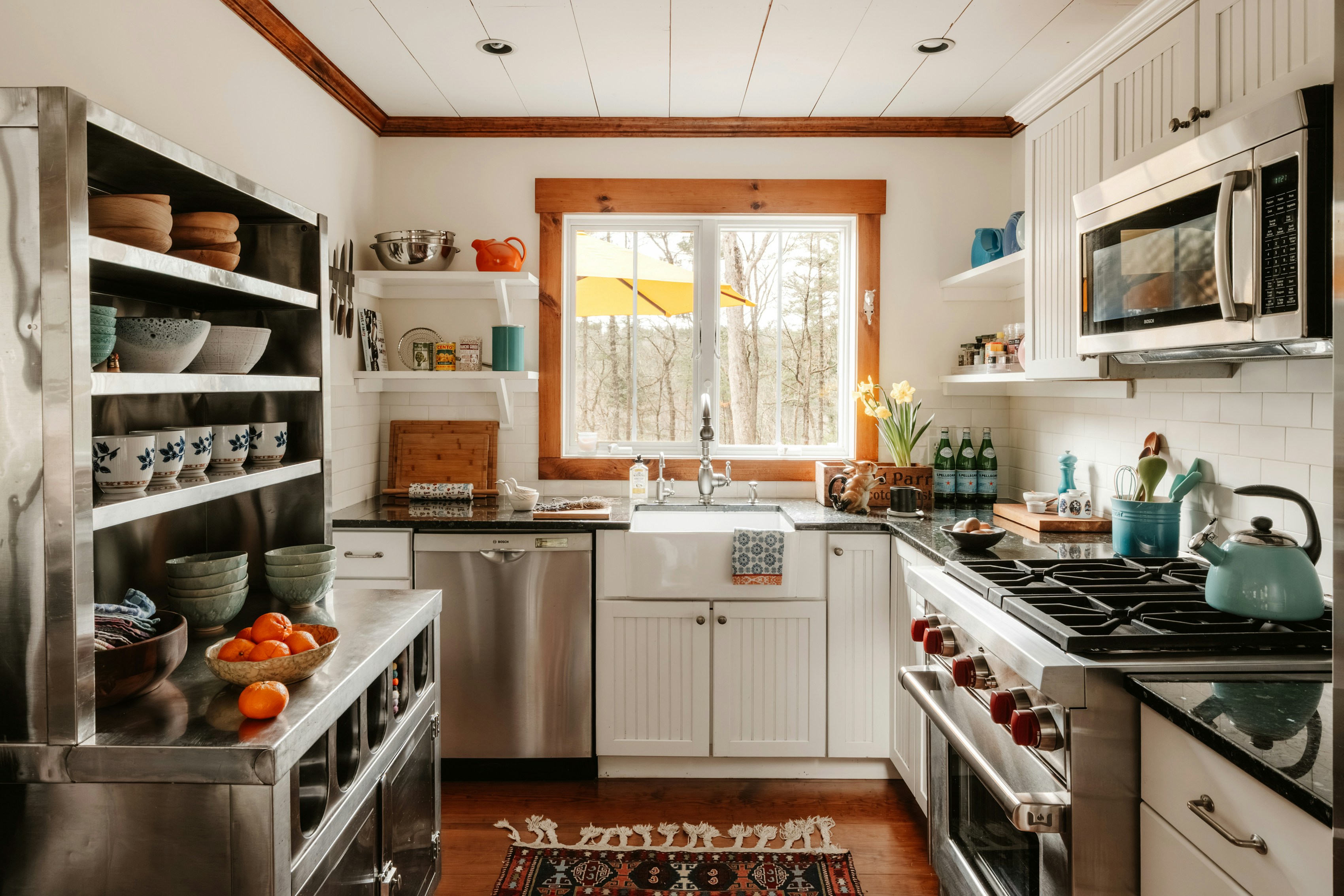 Cottage farmhouse kitchen open steel shelving farmhouse sink white beadboard cabinets