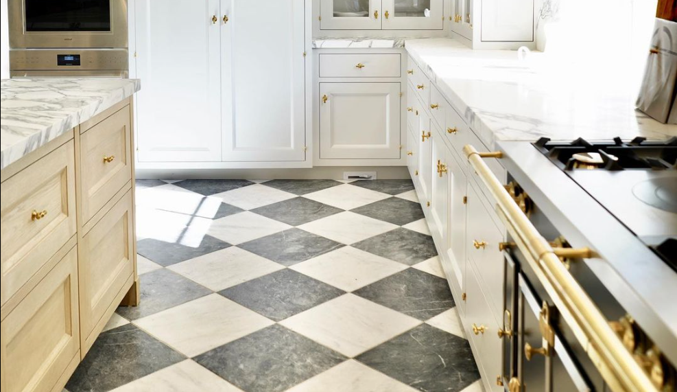 White painted inset kitchen cabinetry with brass hardware, La Cornue range, and diamond marble floor, Newport Beach