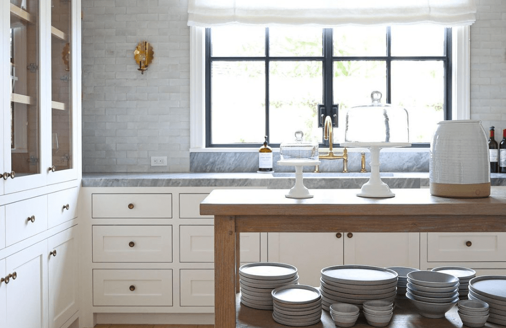 White painted shaker kitchen with inset cabinets, farmhouse sink, and black steel windows, Newport Beach