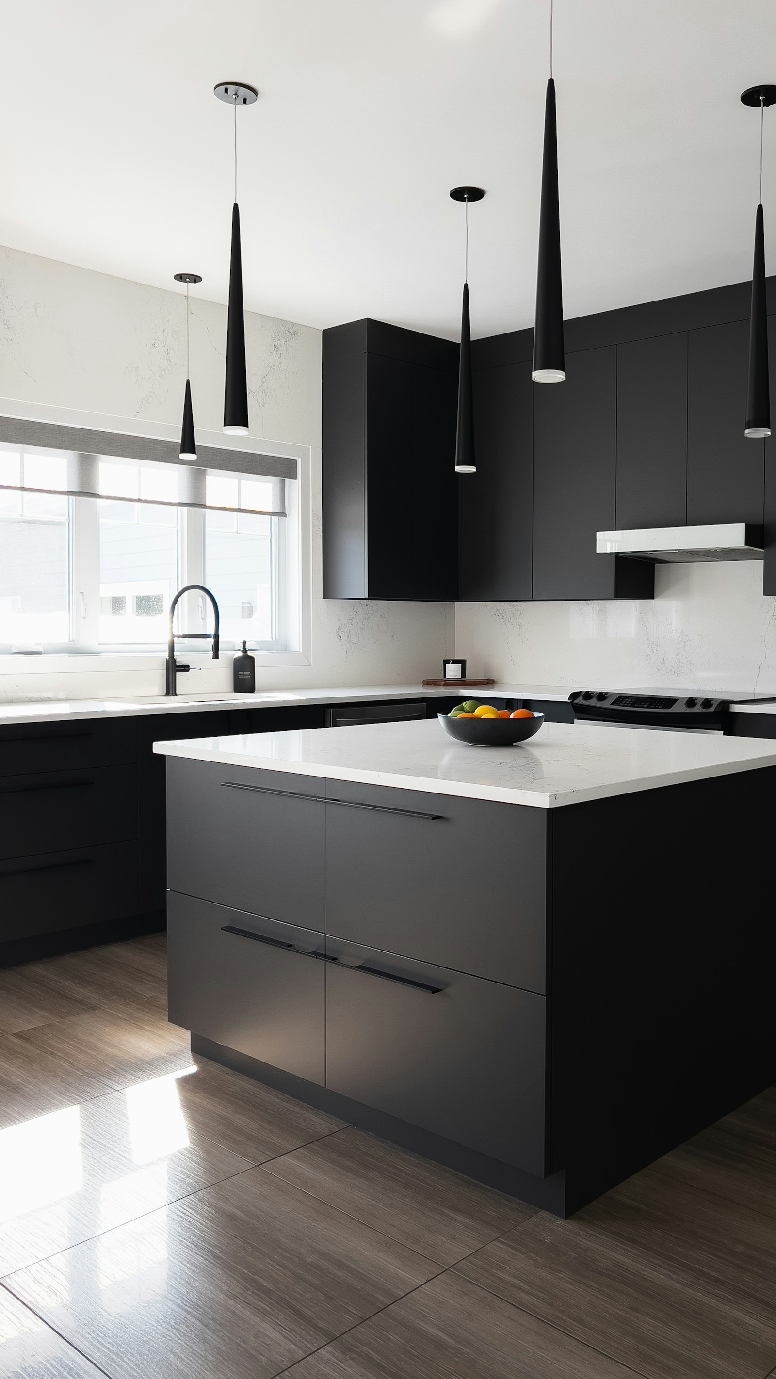 Matte black modern kitchen cabinets with white countertop and minimal hardware