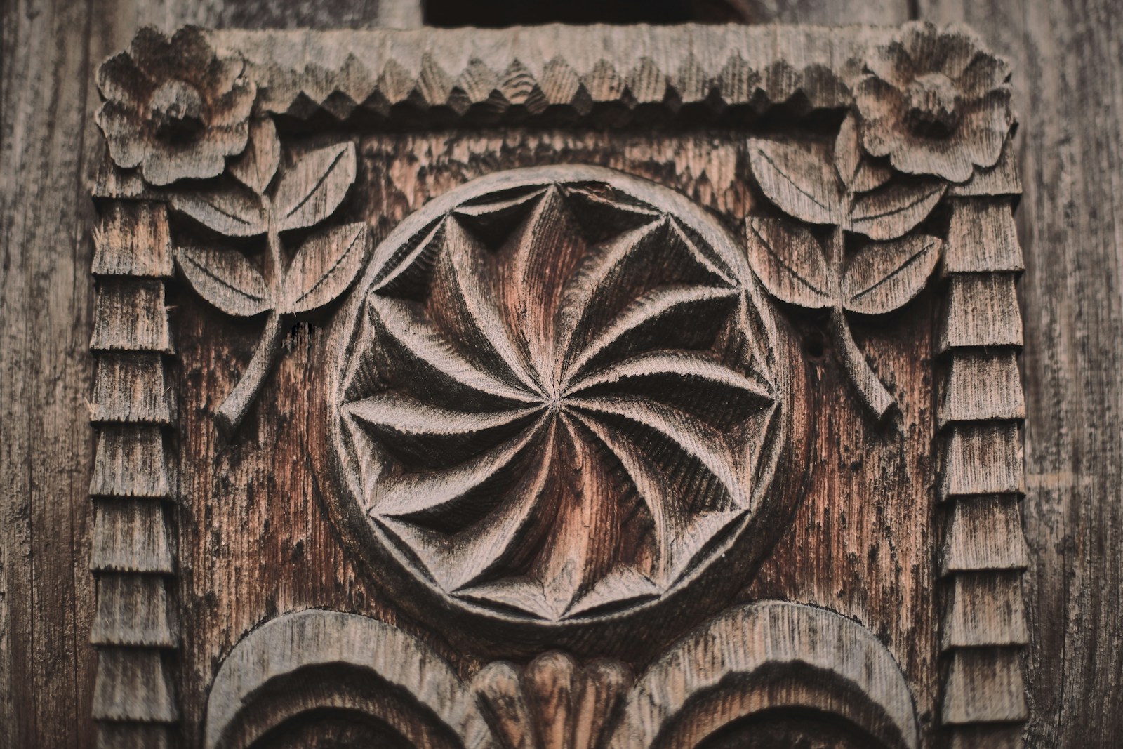 Custom decorative wood millwork with hand-carved floral and scroll patterns
