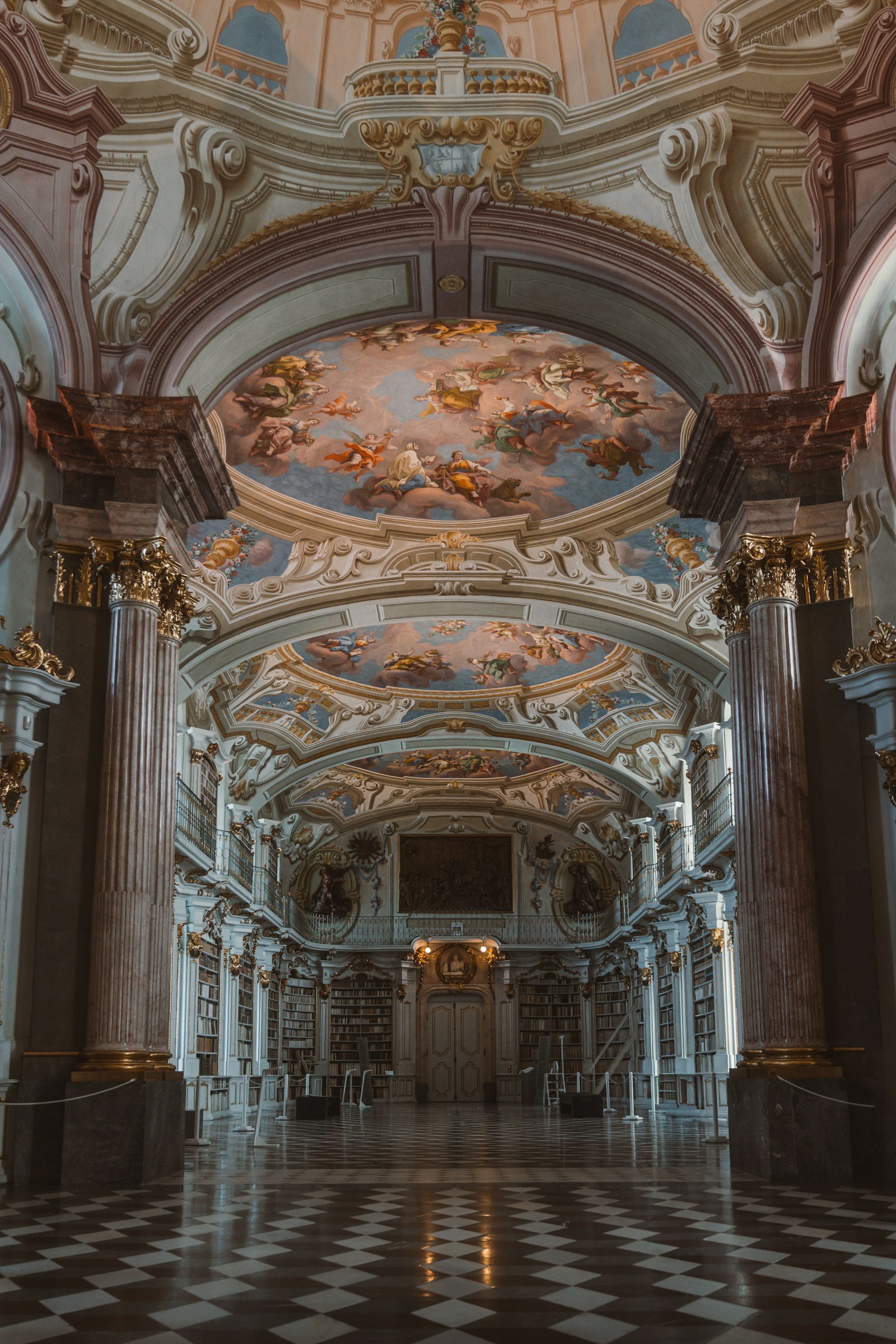 Grand baroque library interior showcasing ornamental gilded woodwork and craftsmanship