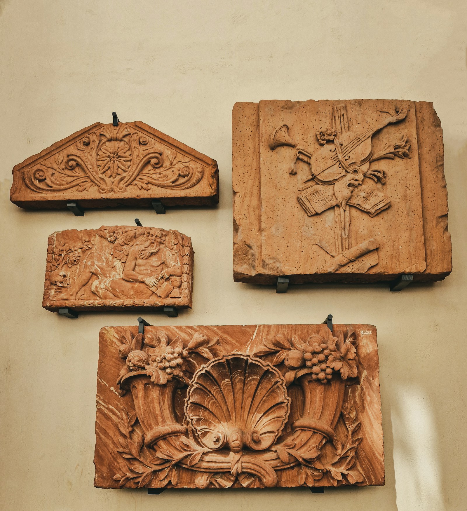 Ornamental wood panel with detailed carved decorative relief and painted finish