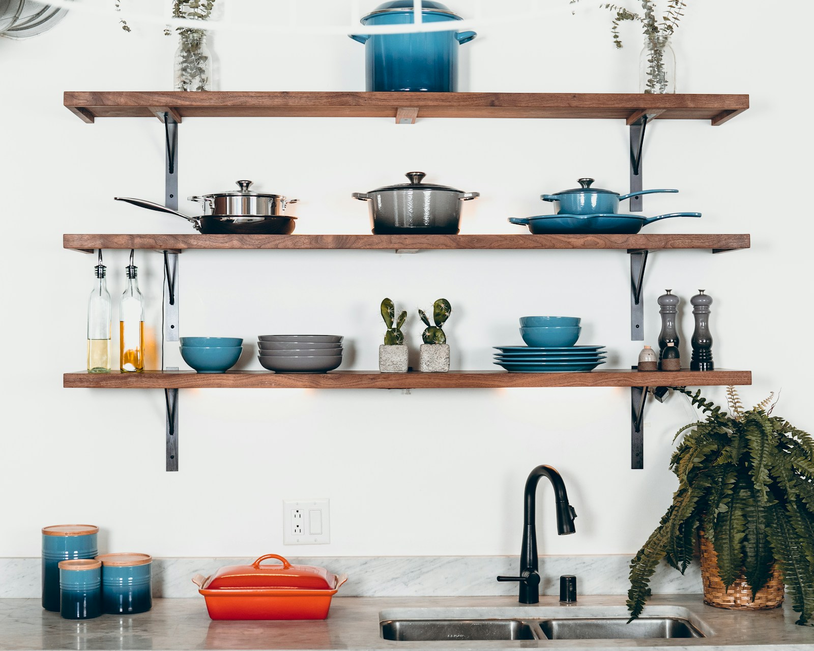 Rustic kitchen floating wood shelves with open display and farmhouse aesthetic