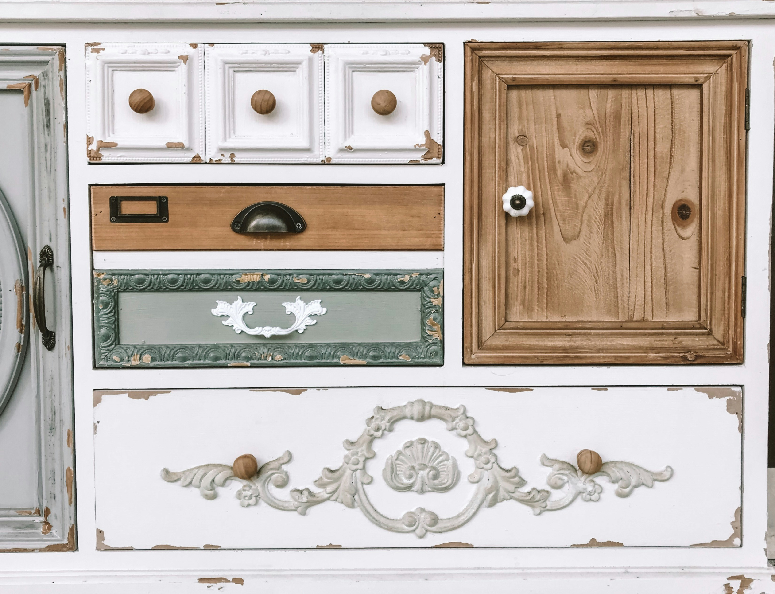 Shabby chic distressed cabinet mixed paint finishes ornate moldings vintage hardware detail