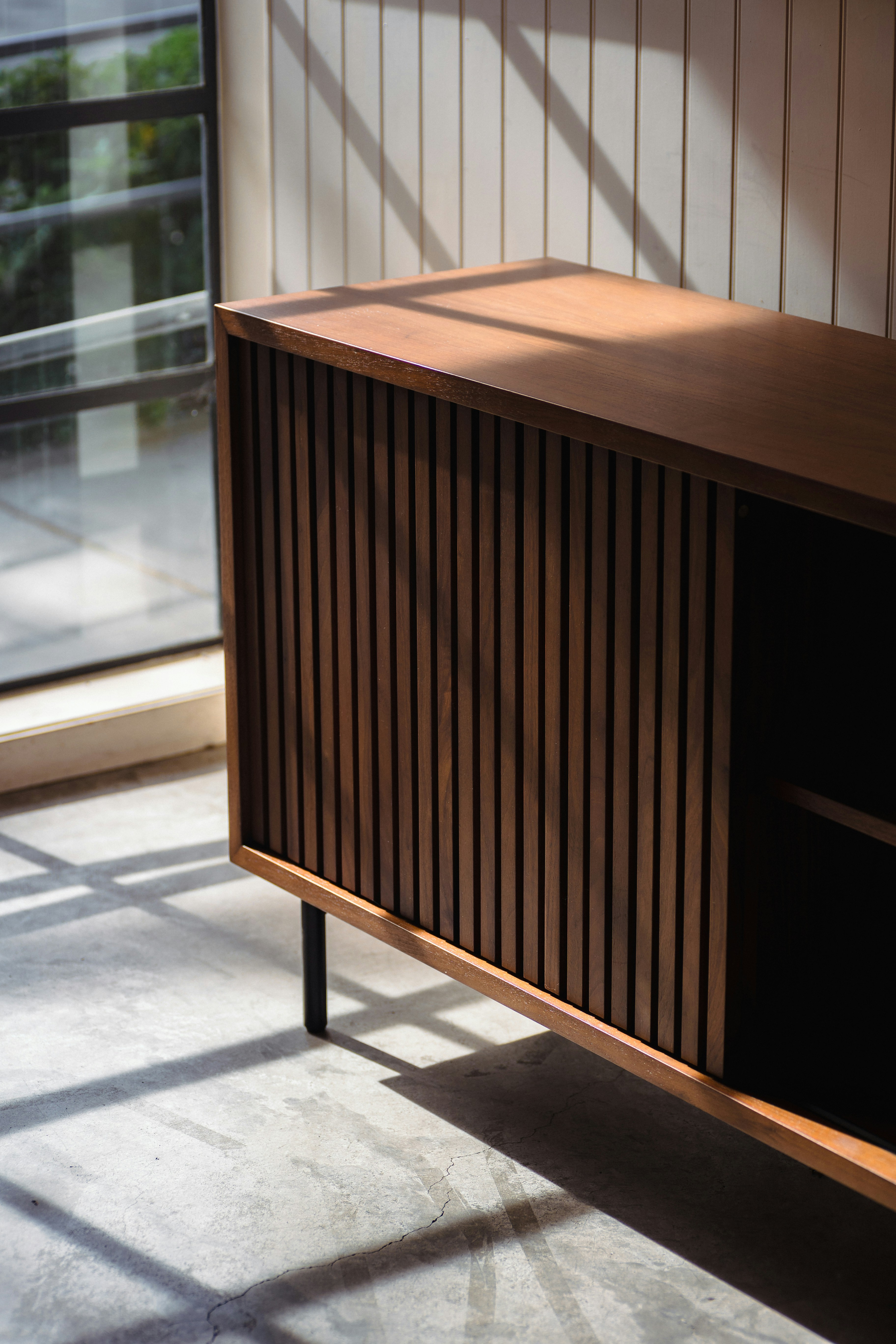 Custom dark walnut slatted sliding door sideboard Japandi interior design