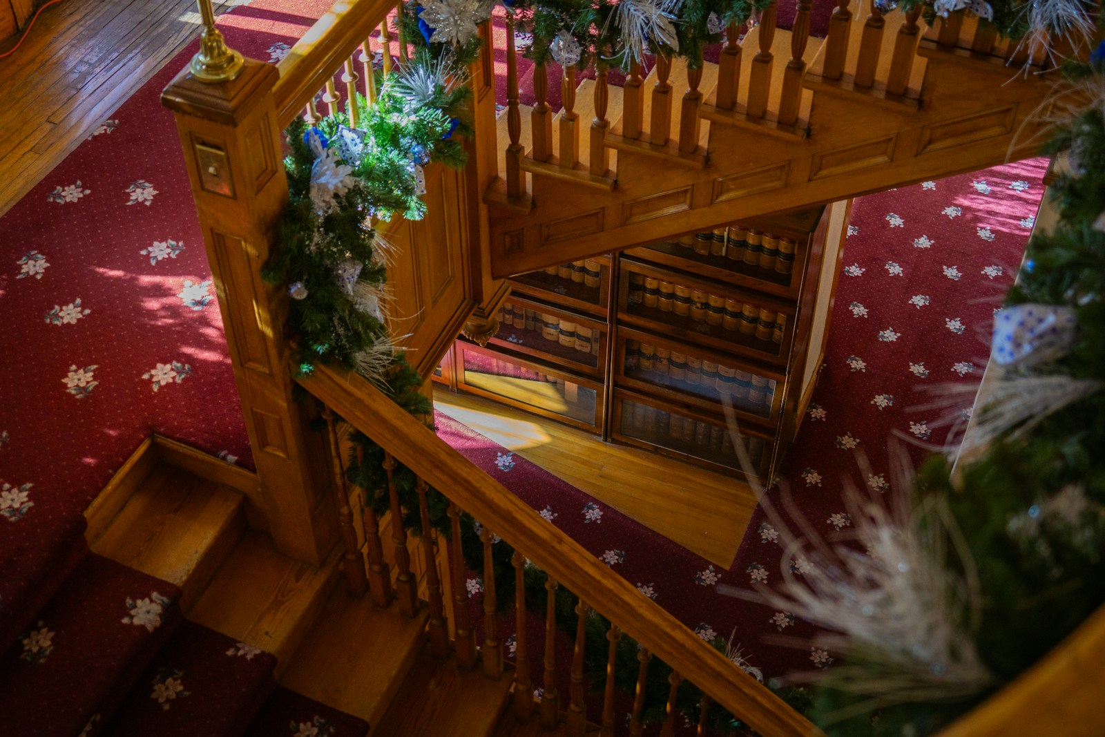 Custom residential staircase with open balustrade and premium hardwood construction