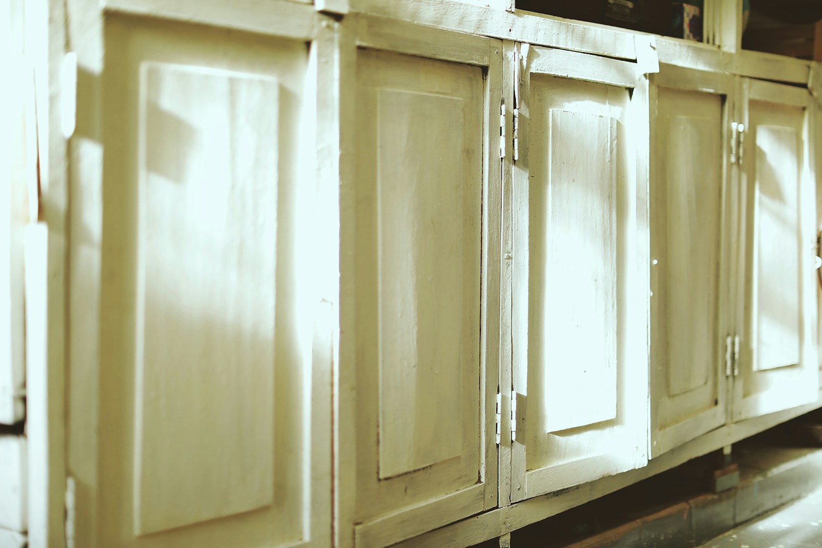 Custom traditional cabinetry with beaded inset doors and warm wood finish
