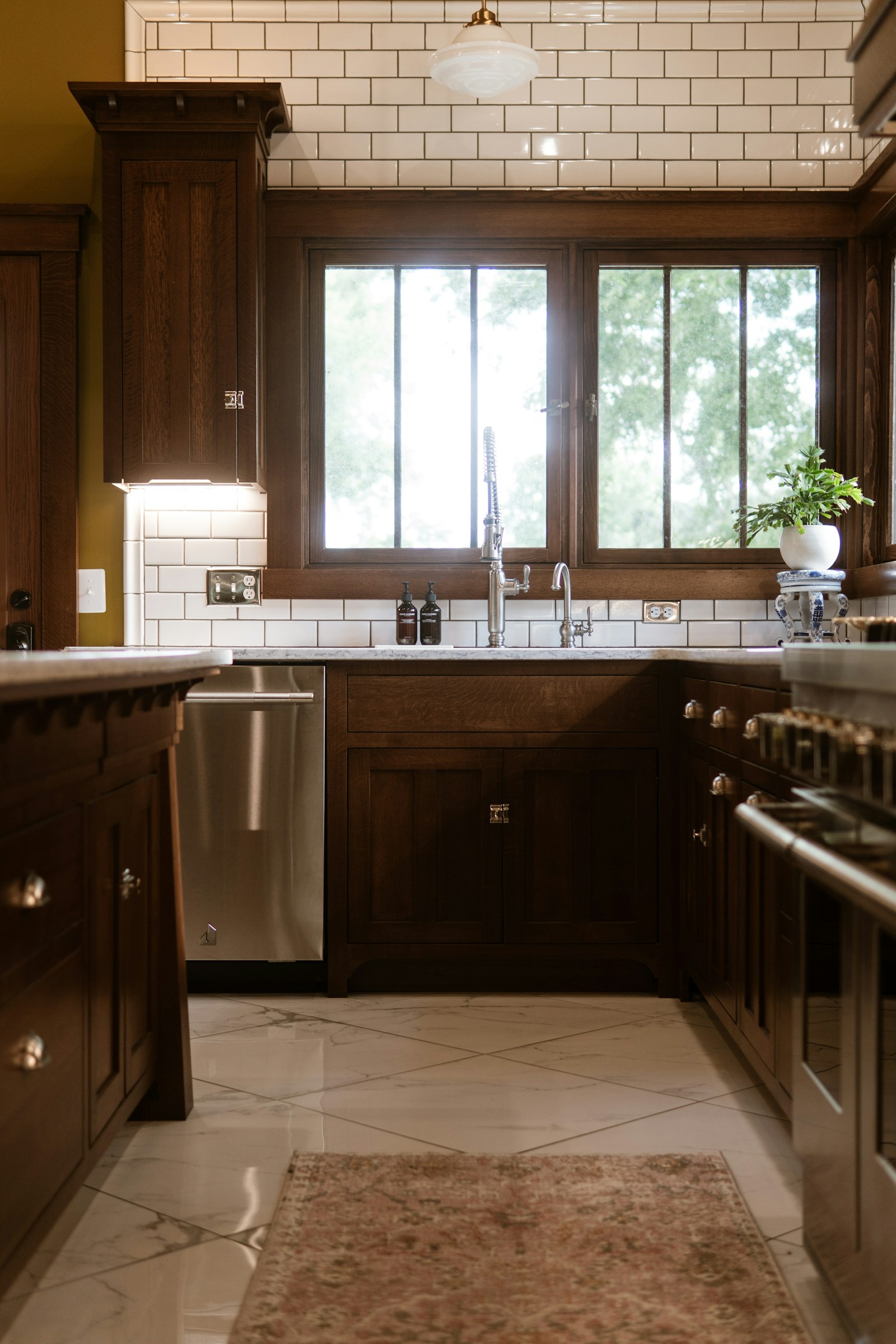 Custom traditional kitchen cabinetry with rich wood stain and crown molding