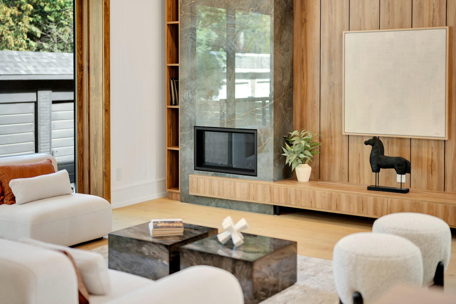 Luxury living room with wood panel TV wall and custom media cabinetry