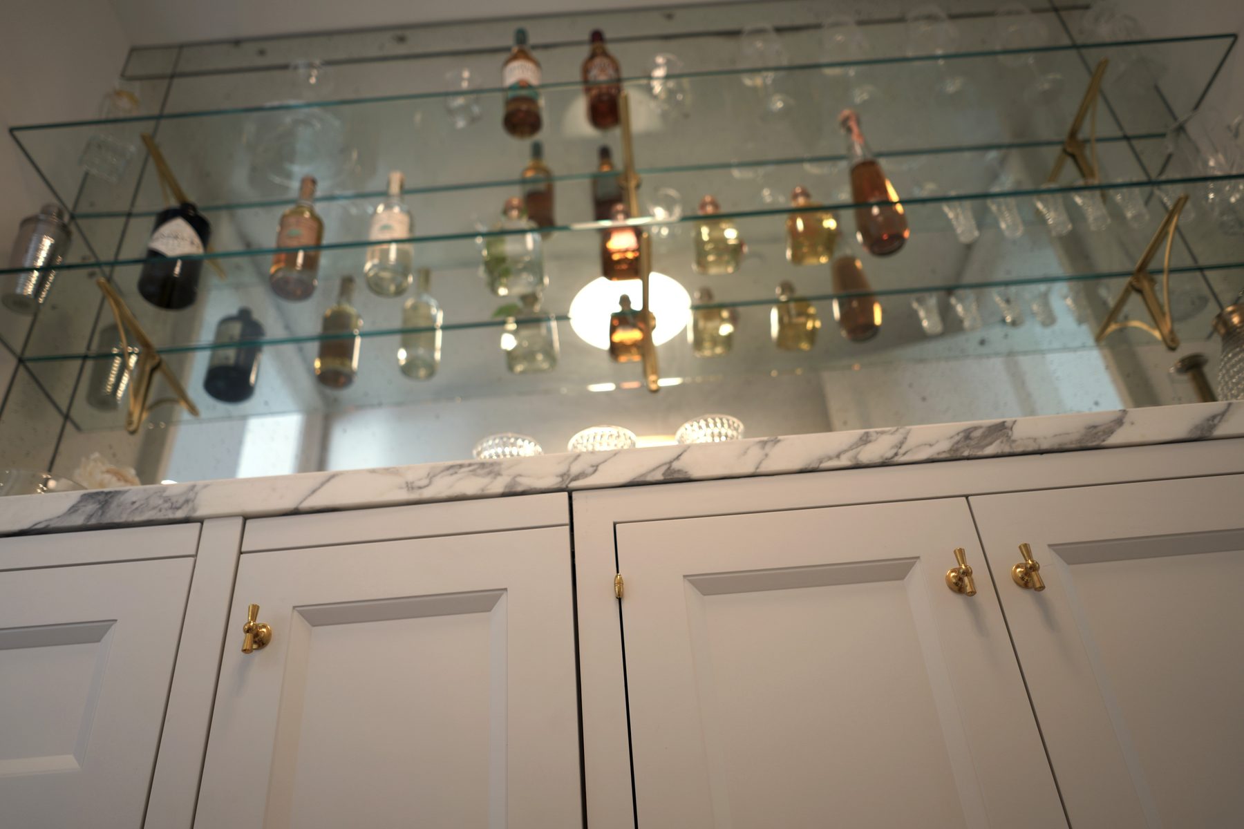 Custom wet bar cabinetry lower angle marble counter