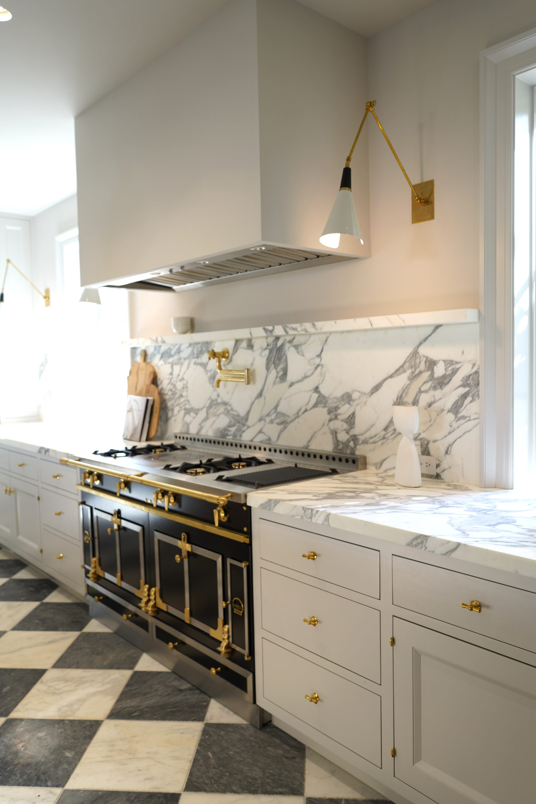 Custom white kitchen range wall cabinet installation detail