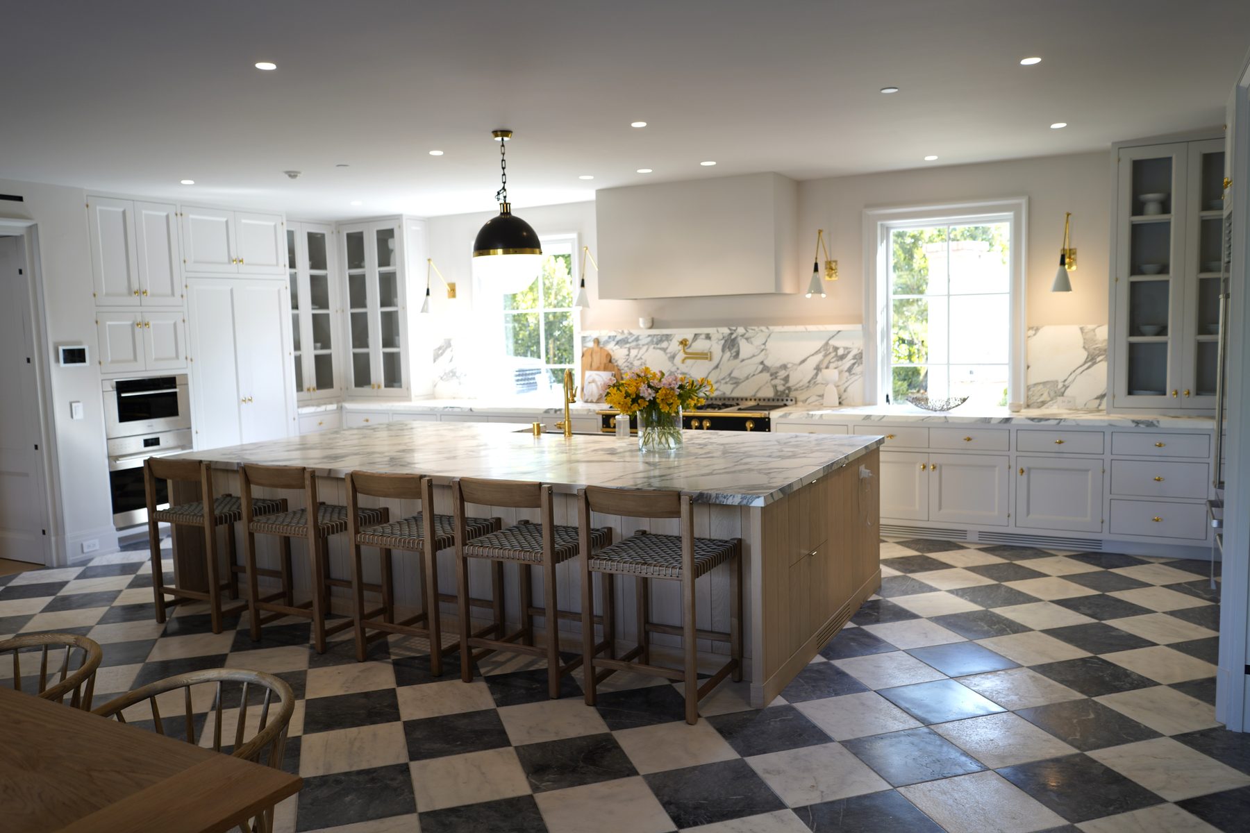 Custom white kitchen with diamond marble floor and island wide view