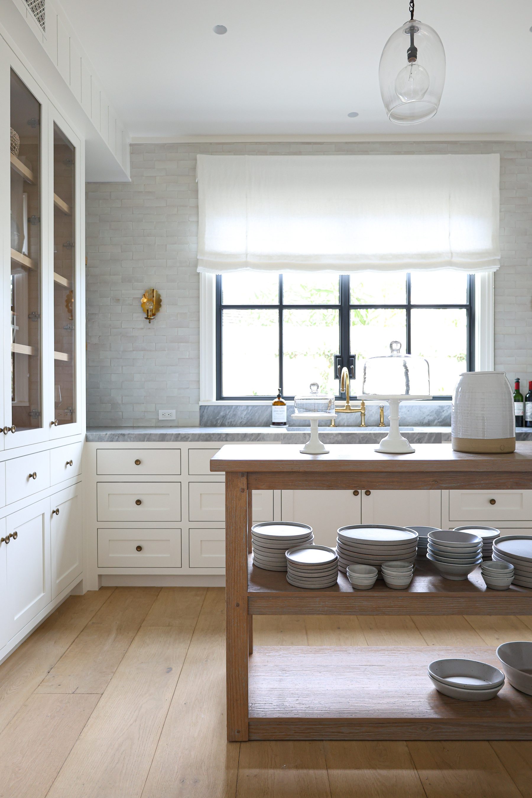 Custom white butler pantry glass-front cabinetry Big Canyon