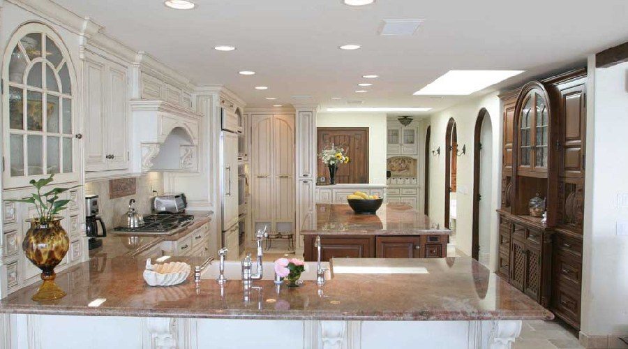 Cream kitchen cabinetry wide arched doorway Big Canyon