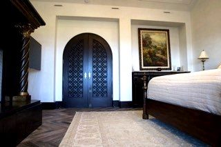 Custom dark mahogany arched doors carved fretwork