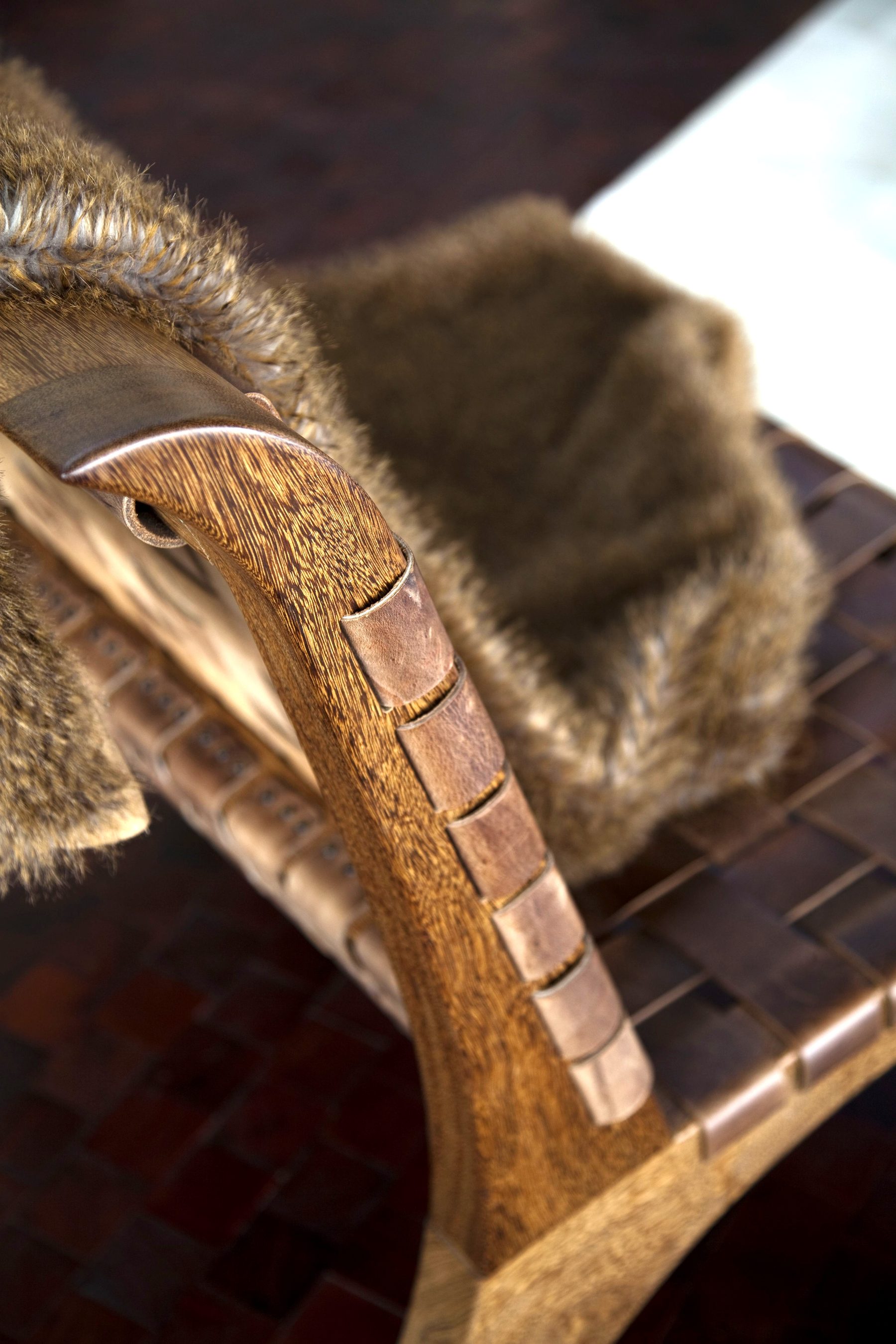 Luxury leather chair fur throw custom interior detail