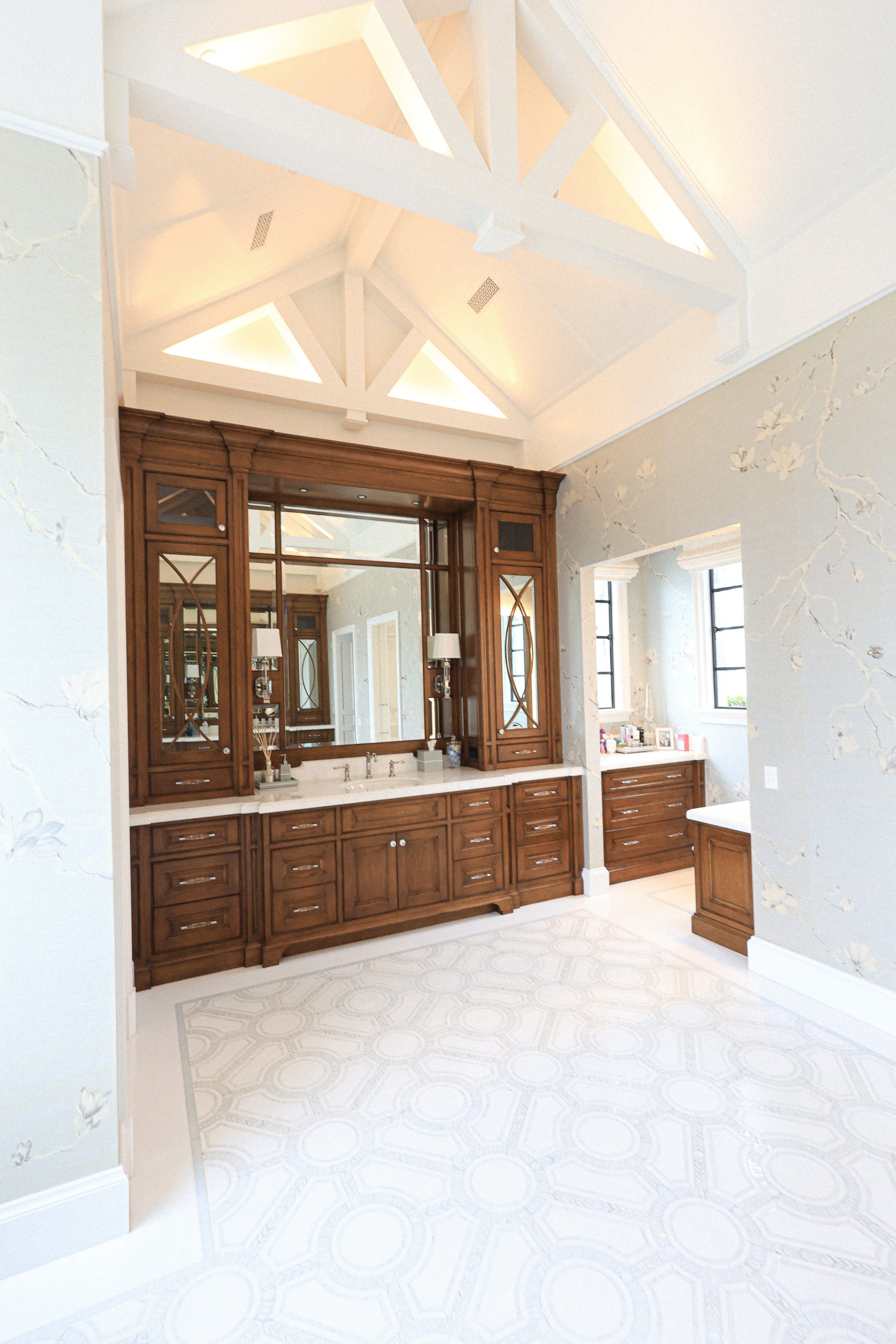Custom dark walnut master bathroom vanity cathedral beam ceiling