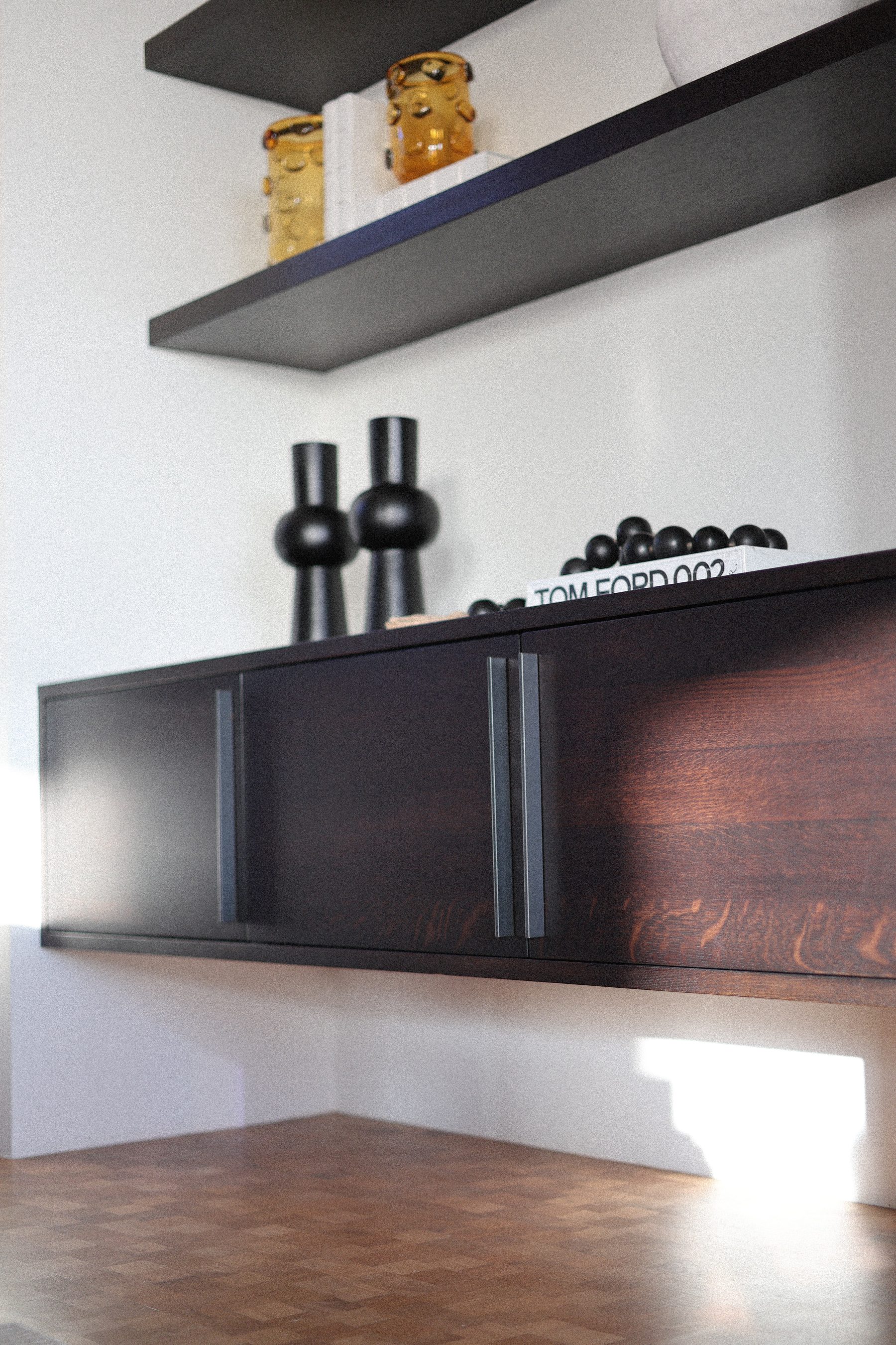 Modern dark floating cabinet open shelving ceramic detail