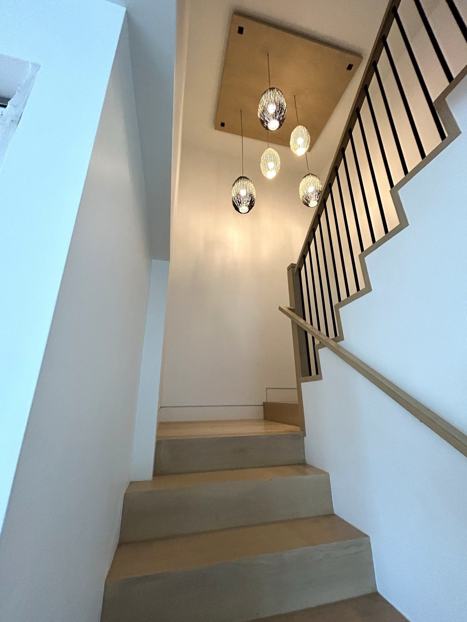 Modern staircase pendant lights oak handrail detail
