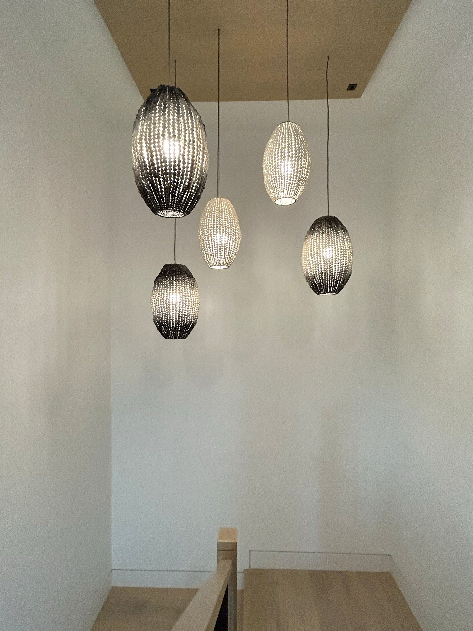 Modern staircase pendant light cluster detail