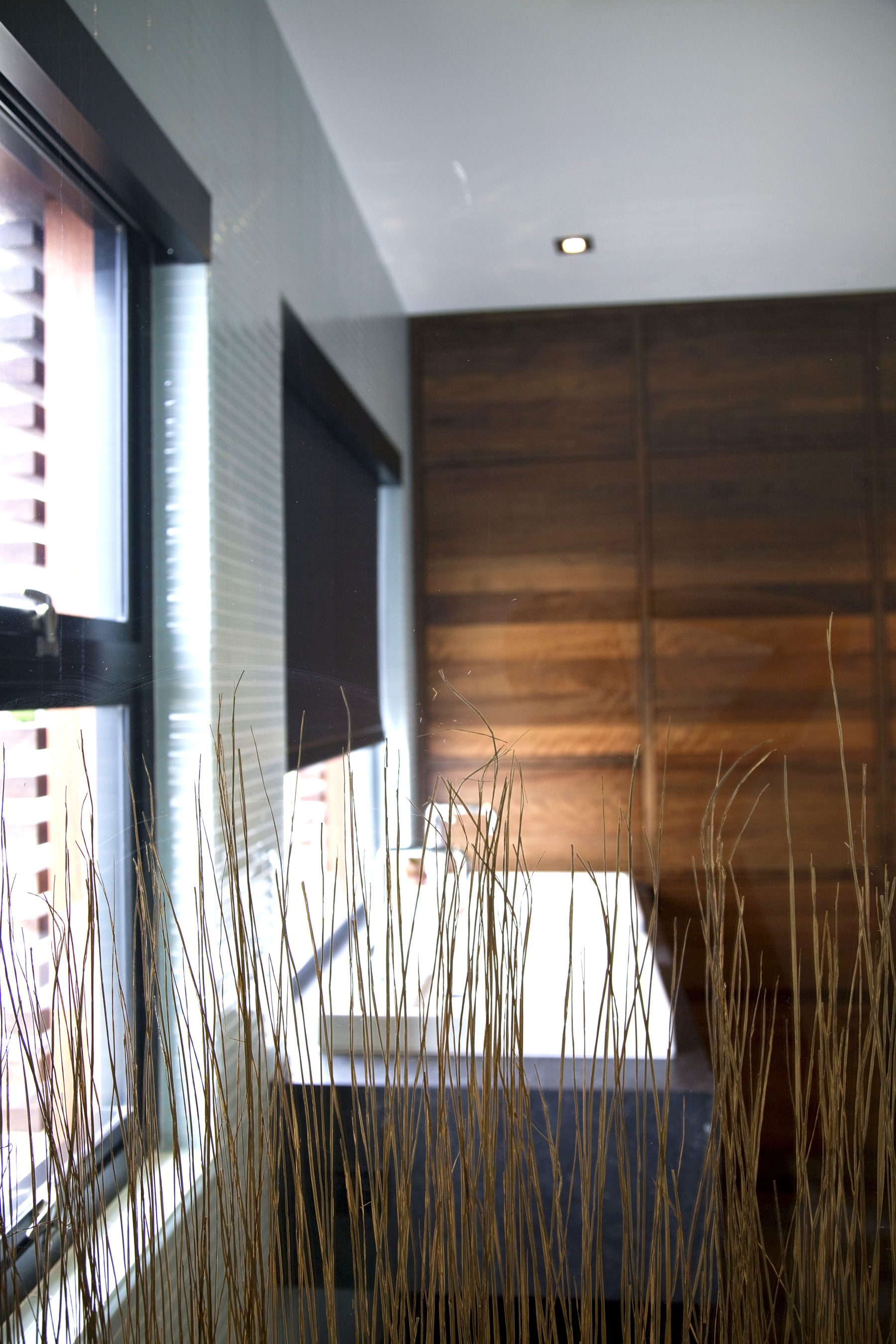 Dark wood custom bathroom cabinetry Newport Beach residence