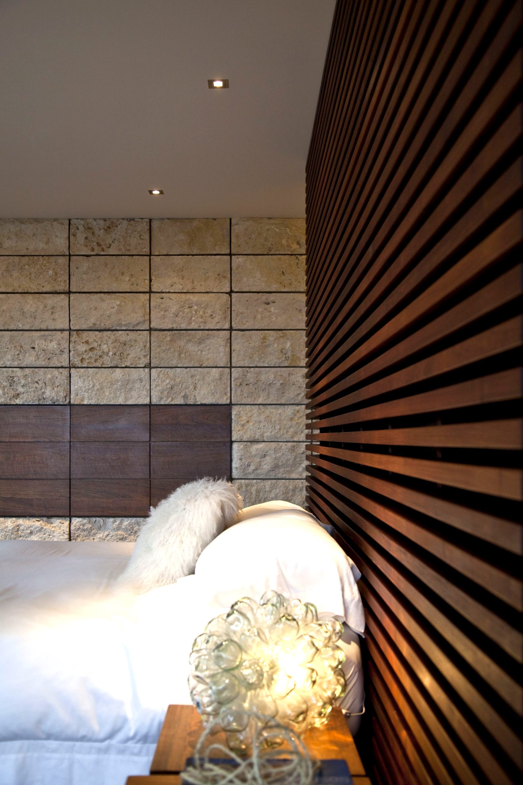Custom wood slat built-in headboard Newport Beach bedroom