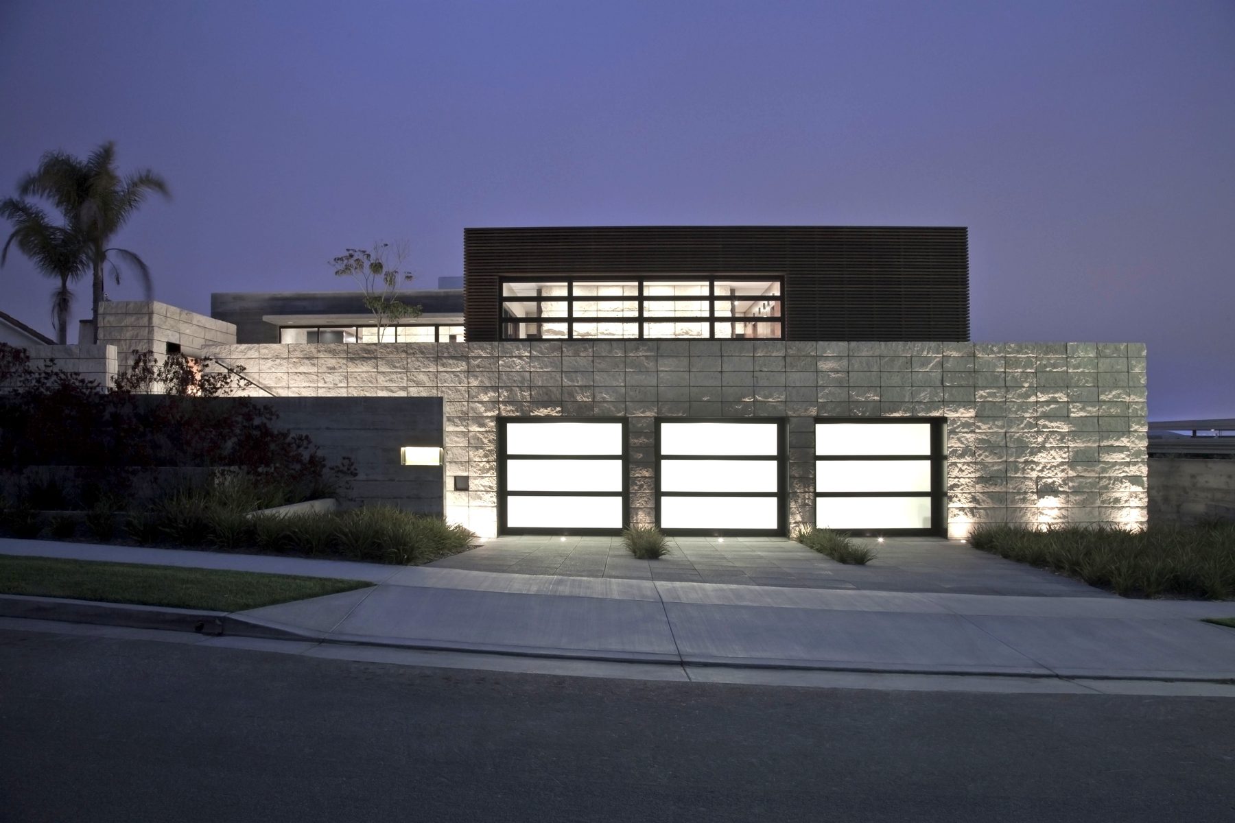 Newport Beach luxury residence front exterior stone glass night