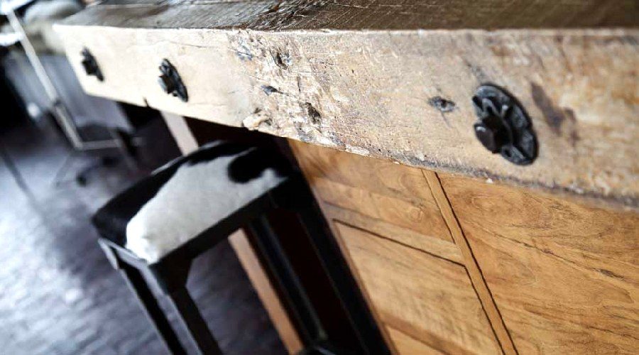 Kitchen reclaimed wood island cowhide seating Newport Beach