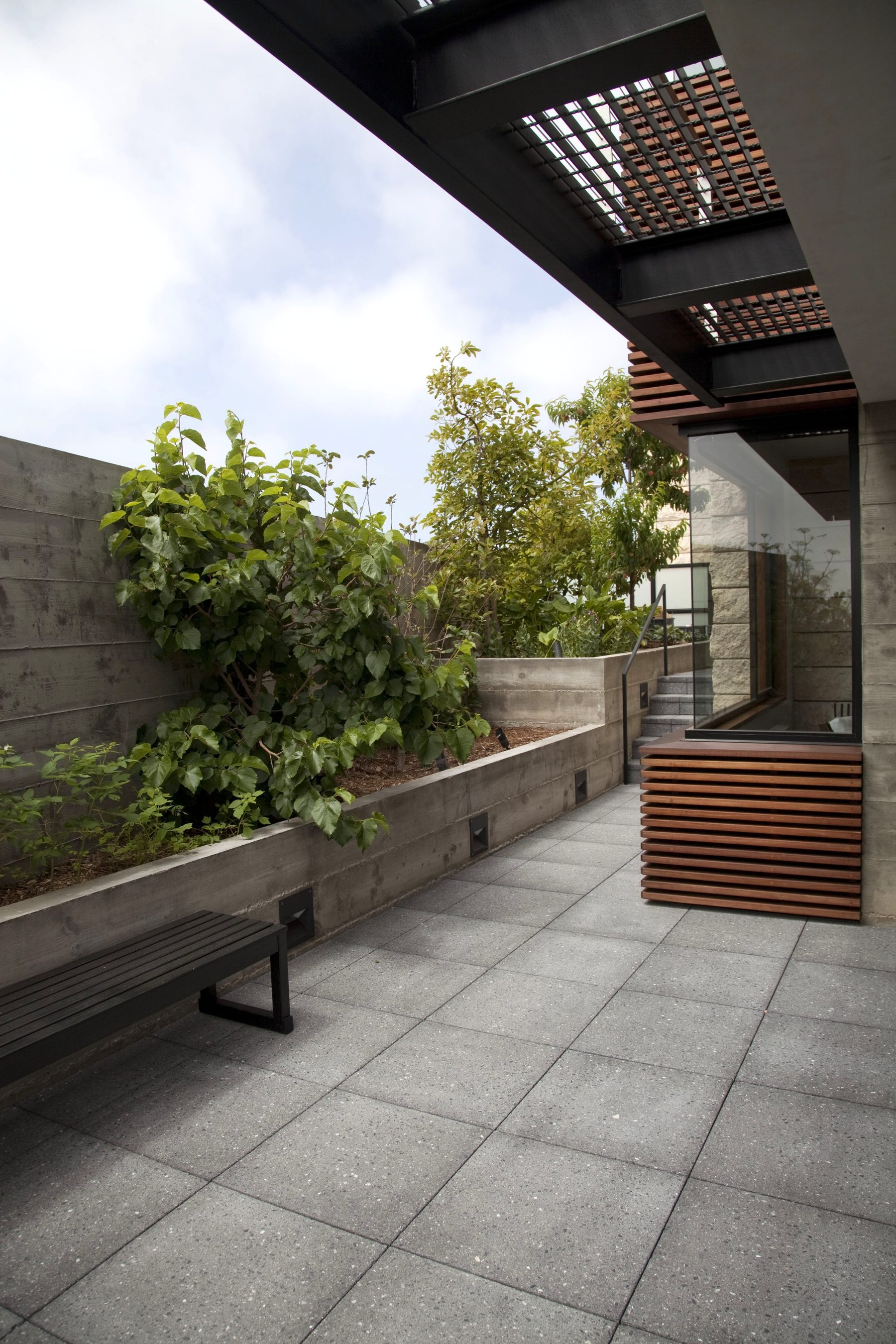 Newport Beach terrace concrete louvered wood panels