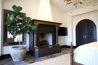 Traditional bedroom dark carved arched doorway cabinetry