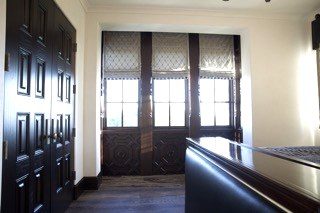 Traditional dark wood bar panel doors cabinetry detail