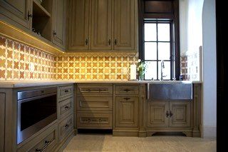 Traditional sage green kitchen cabinetry decorative tile backsplash
