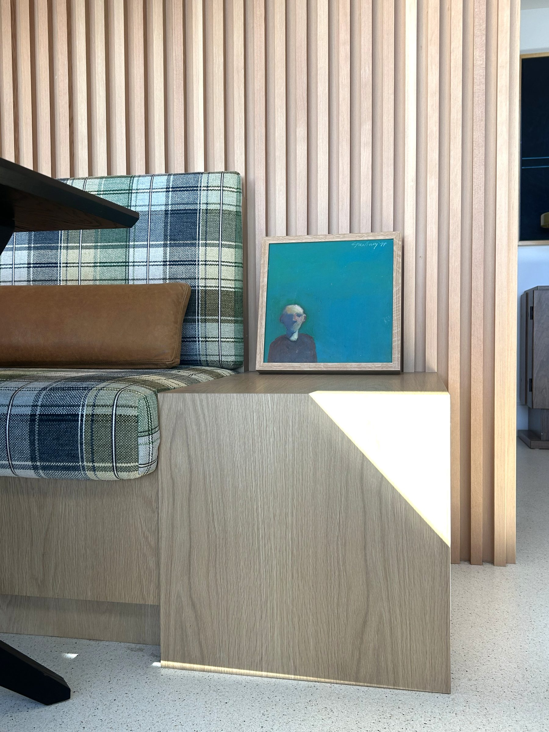 Modern white oak banquette end panel painting detail