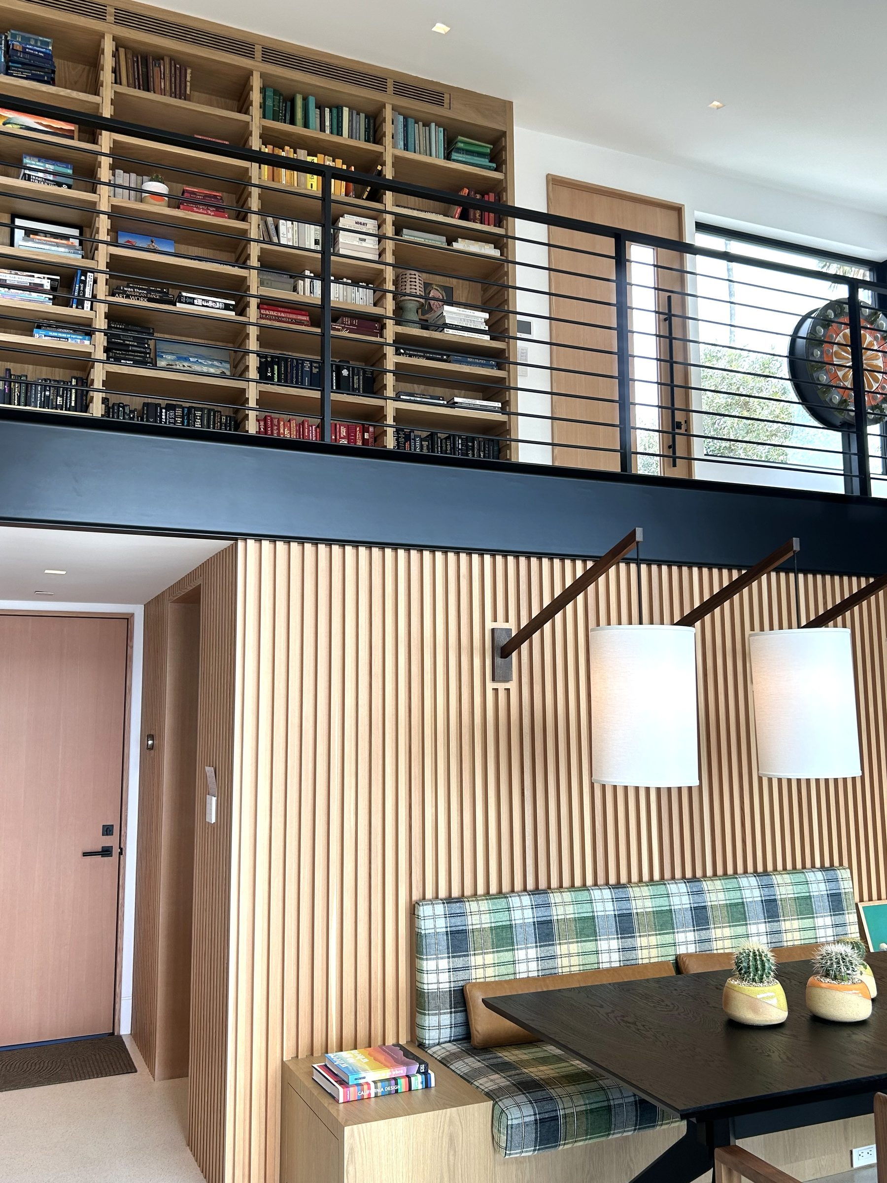 Modern white oak home bookcase staircase overview