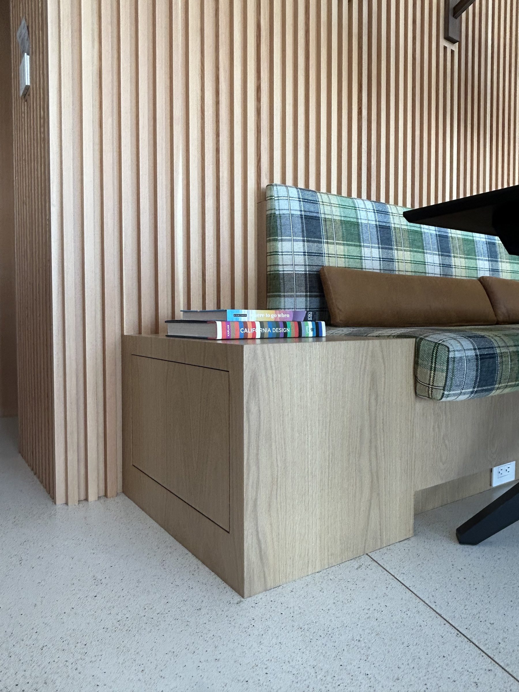 Modern white oak banquette cabinet end panel close-up