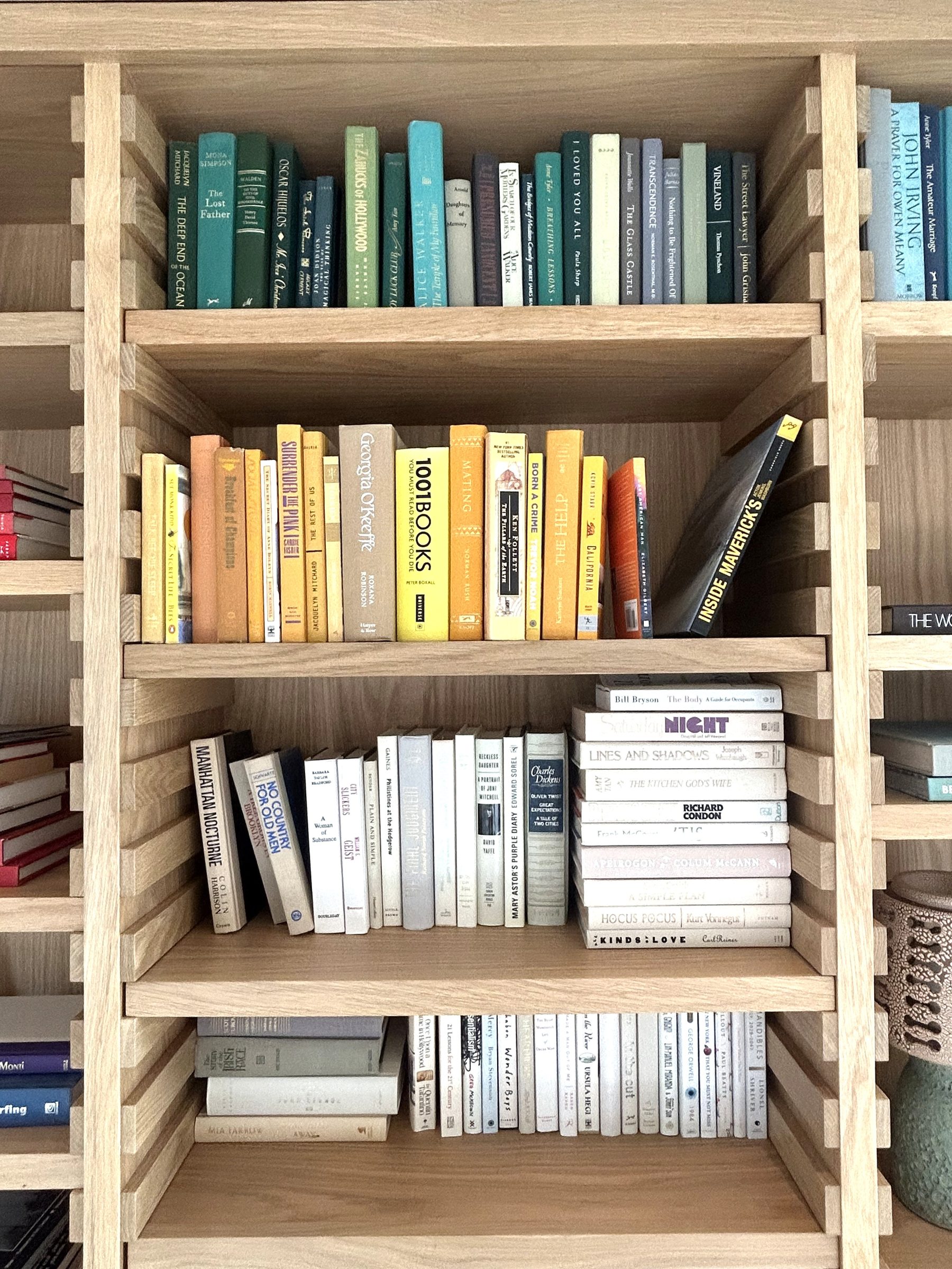 Custom white oak bookcase colorful book collection detail