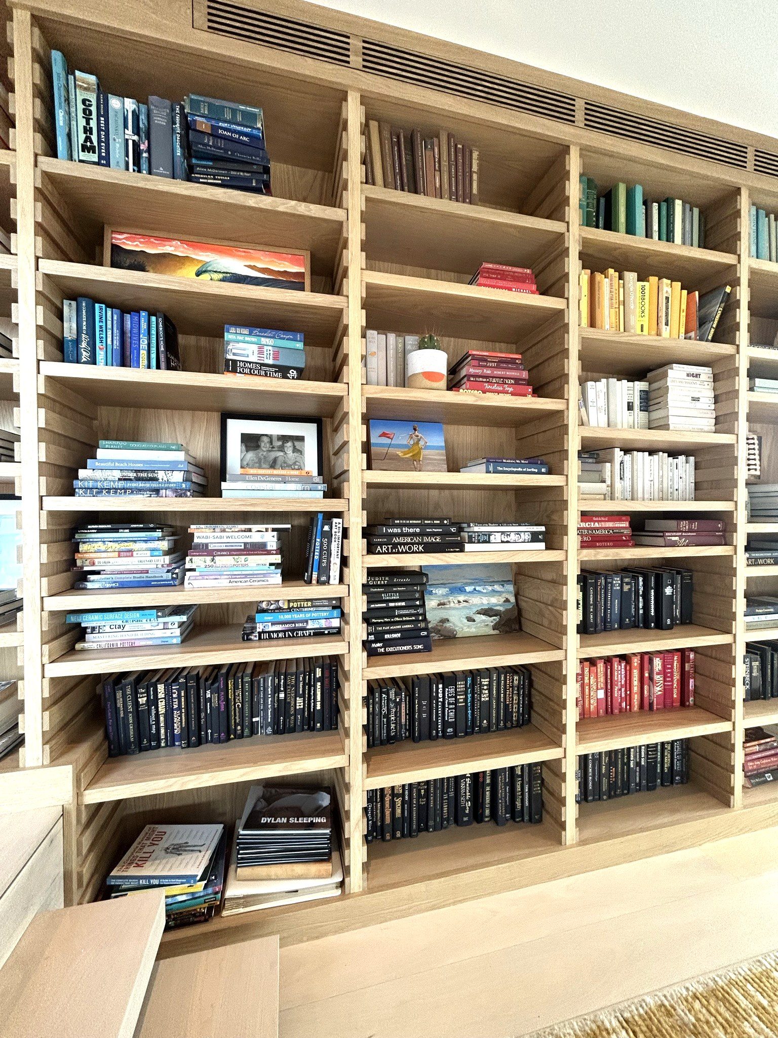Custom white oak bookcase full-width built-in library
