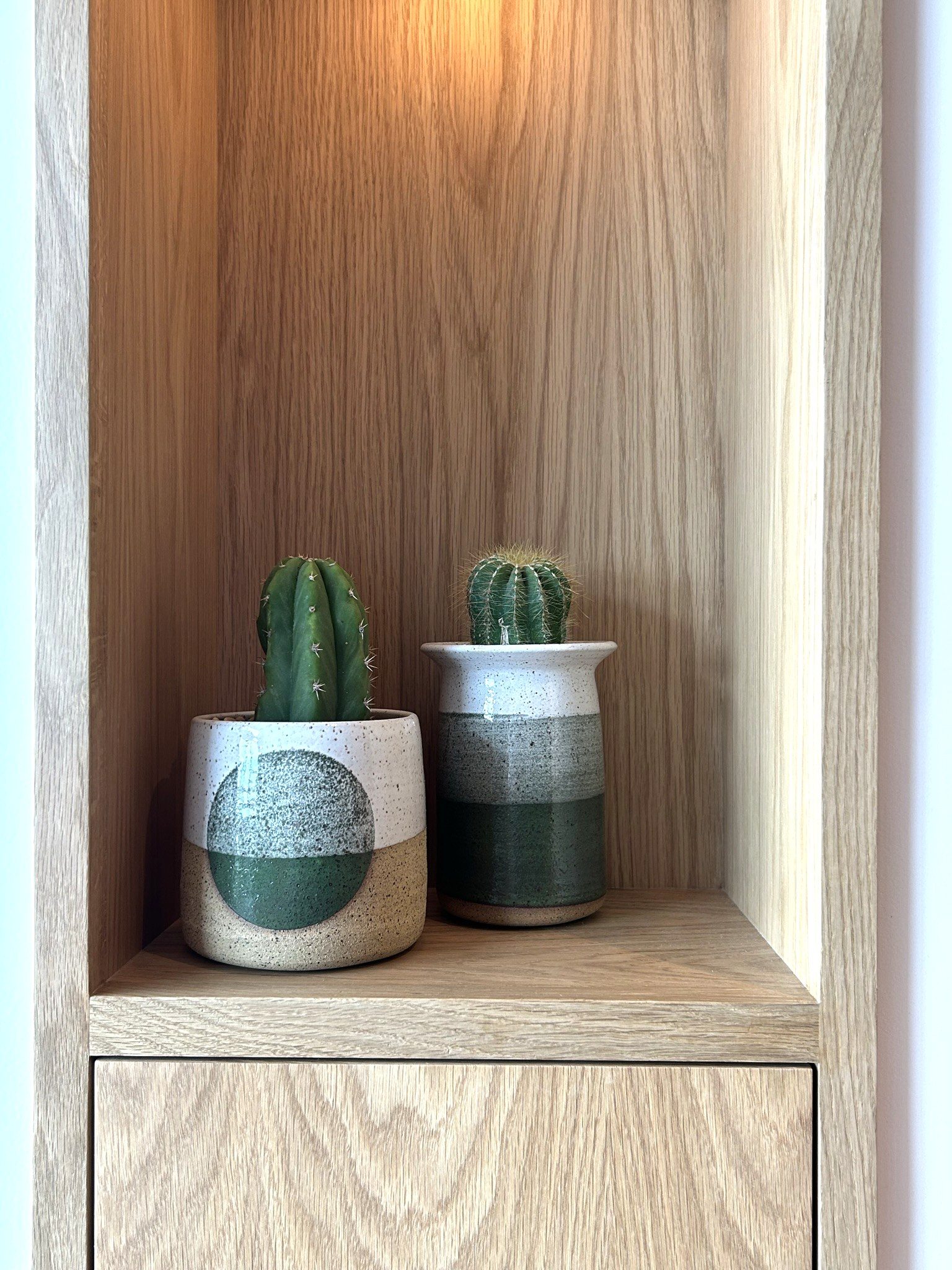 Custom white oak cabinet niche cactus styling detail