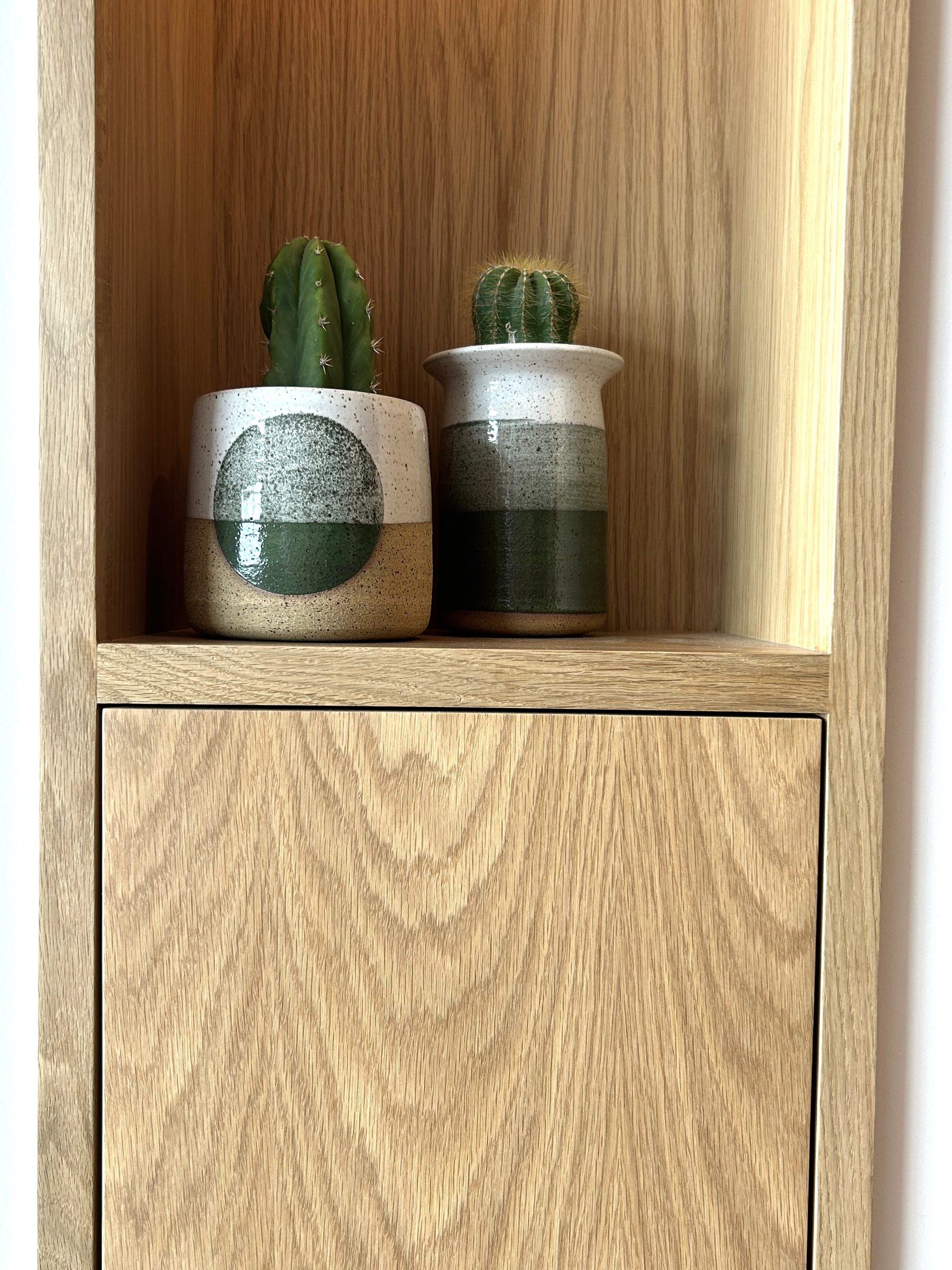 Custom white oak cabinet niche cactus pottery styling