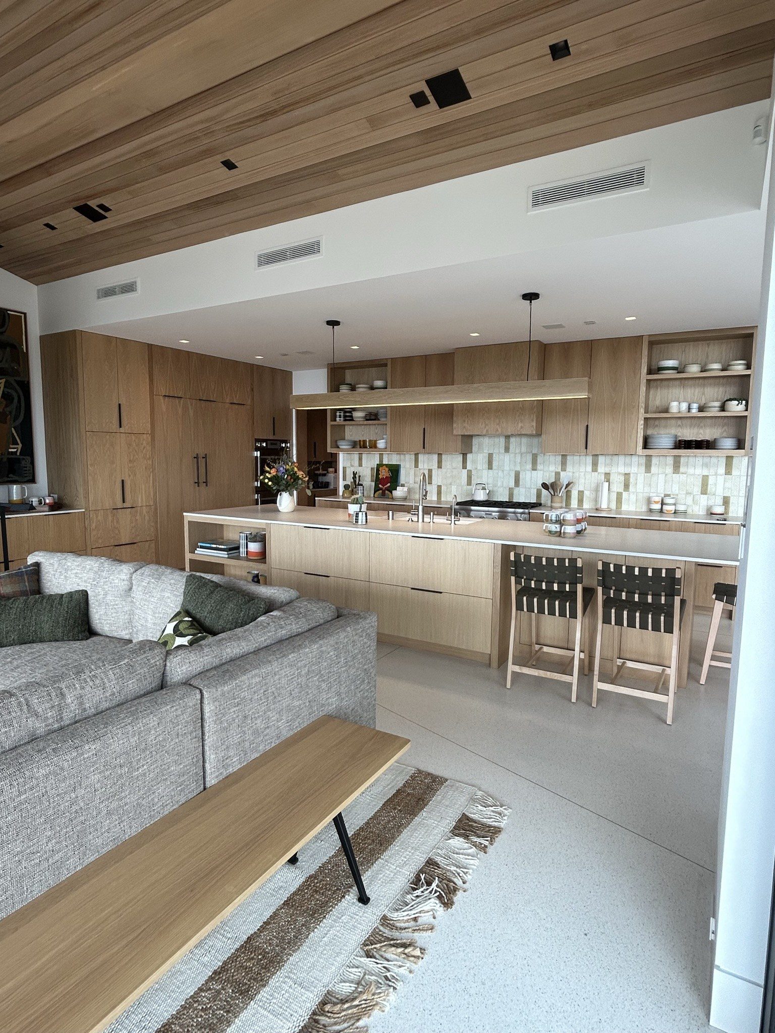 Modern white oak kitchen open-plan cabinetry island view