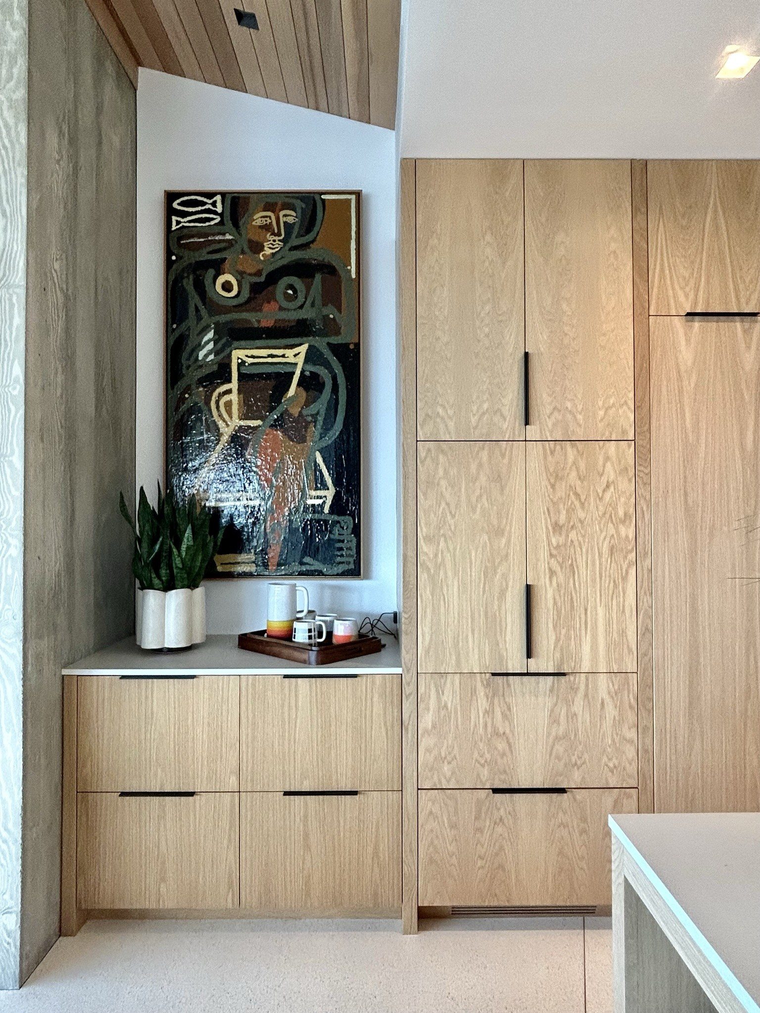 Modern white oak kitchen cabinetry drawers pantry wall